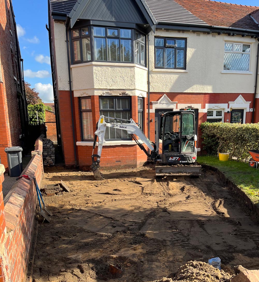 Mini Digger working on Drive in Southport